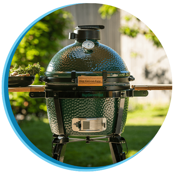 A grill with the lid open and a blue handle.