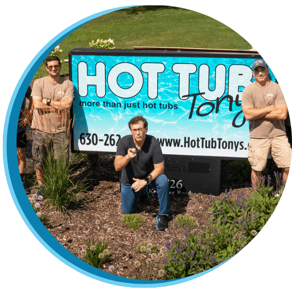 A group of men standing in front of a sign.