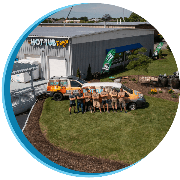 A group of people standing in front of a van.