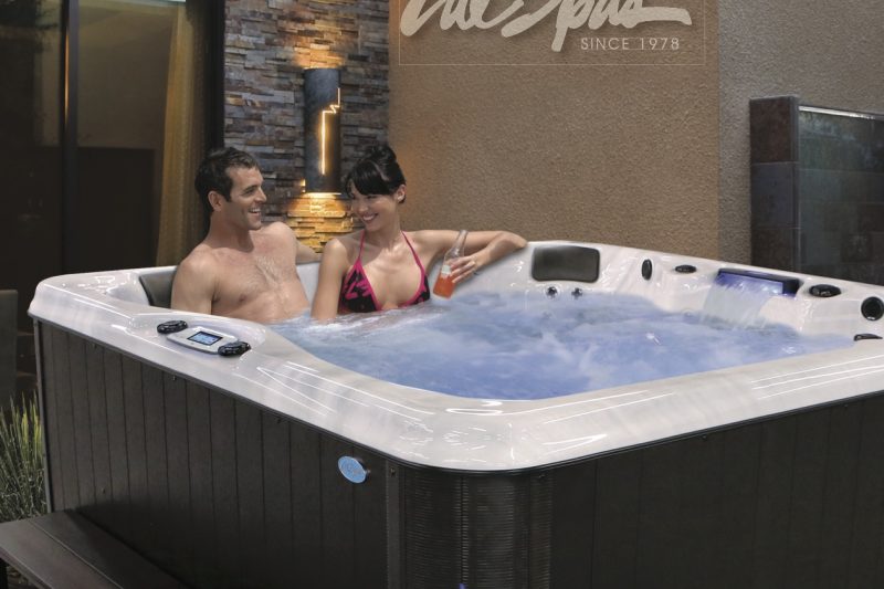 Two people in a cal spas hot tub